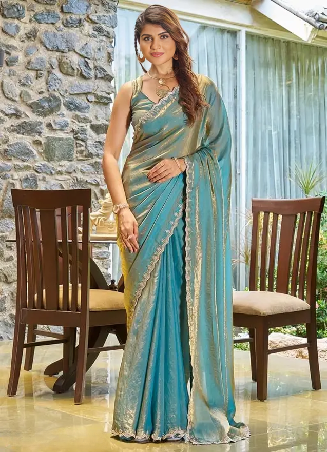 A saree of Fendy satin with zarkhad daimond with cutwork border.